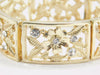 Gold Tone Elastic Bracelet with Flower/Leaf Design and Crystals